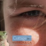 Muskoka cottage kid with frog