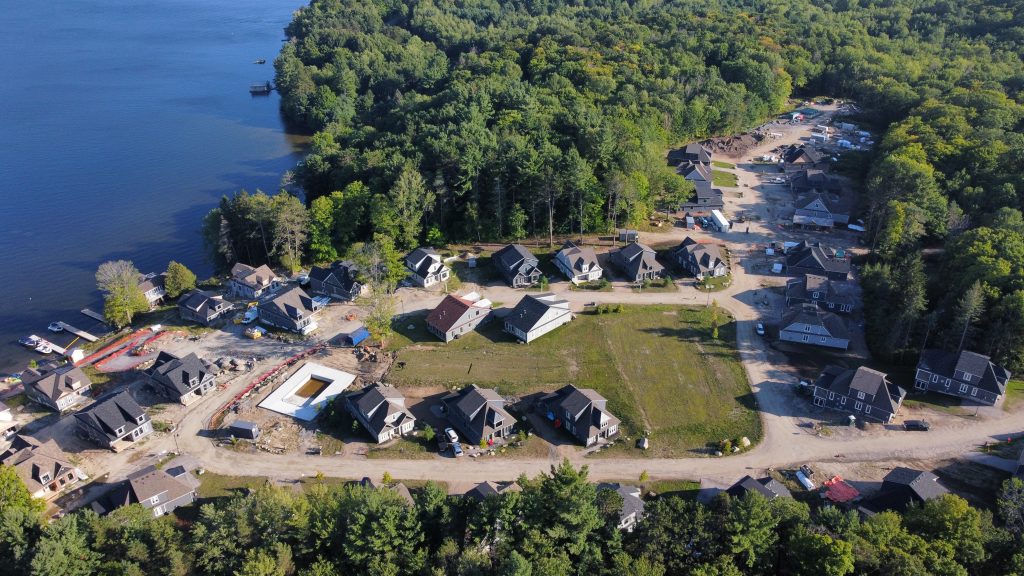 An aerial view of the 43 units of Legacy Cottages on the shore of Lake Rosseau, Minett, Muskoka, Ontario. 